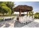 Outdoor kitchen with tiki bar and seating at 801 Golden Bear Dr, Kissimmee, FL 34747