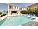 Luxury home with a sparkling pool, spa, and patio furniture at 801 Golden Bear Dr, Kissimmee, FL 34747