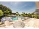 Resort-style pool and spa with seating and a fenced backyard at 801 Golden Bear Dr, Kissimmee, FL 34747