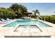 Inviting pool and spa with lounge chairs and outdoor bar at 801 Golden Bear Dr, Kissimmee, FL 34747