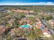 Beautiful aerial view showcasing the community's pool and lush green spaces at 832 Grand Regency Pt # 102, Altamonte Springs, FL 32714