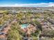 A wide aerial shot showcasing a condo community, complete with manicured grounds, pool, and surrounding amenities at 832 Grand Regency Pt # 102, Altamonte Springs, FL 32714