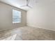 Bright bedroom with tile flooring, ceiling fan, and large window that fills the space with light at 832 Grand Regency Pt # 102, Altamonte Springs, FL 32714