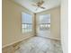 Bedroom featuring ceramic tile flooring and a large double window at 832 Grand Regency Pt # 102, Altamonte Springs, FL 32714