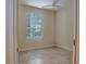 Simple bedroom with tile floors and a window at 832 Grand Regency Pt # 102, Altamonte Springs, FL 32714