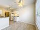 Bright kitchen features white appliances, granite countertops, and tile flooring throughout at 832 Grand Regency Pt # 102, Altamonte Springs, FL 32714