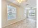 Bright living room featuring ceramic tile flooring, neutral paint, and large windows at 832 Grand Regency Pt # 102, Altamonte Springs, FL 32714