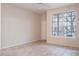 Spacious living room featuring tile floors and a large window at 832 Grand Regency Pt # 102, Altamonte Springs, FL 32714