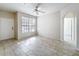 Bright living room featuring ceramic tile flooring, neutral paint and a ceiling fan at 832 Grand Regency Pt # 102, Altamonte Springs, FL 32714