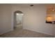 Open living room with archway to bathroom at 832 Grand Regency Pt # 102, Altamonte Springs, FL 32714