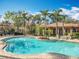 Community pool with a beach-style entry, lush landscaping, and a nearby recreation center at 832 Grand Regency Pt # 102, Altamonte Springs, FL 32714