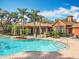 Community pool with a beach-style entry, lush landscaping, and a nearby recreation center at 832 Grand Regency Pt # 102, Altamonte Springs, FL 32714