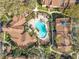 Aerial view of a community pool featuring lounge chairs, landscaping, and well maintained grounds at 832 Grand Regency Pt # 102, Altamonte Springs, FL 32714