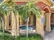 Outdoor spa area with covered colonnade, mature landscaping at 832 Grand Regency Pt # 102, Altamonte Springs, FL 32714