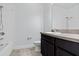 Clean bathroom with dark vanity, shower, and bathtub at 8757 Via Tavoleria Way, Windermere, FL 34786