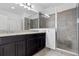 Bathroom with double sinks, granite countertop, and shower at 8757 Via Tavoleria Way, Windermere, FL 34786