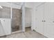 Bathroom with shower, toilet, and double doors at 8757 Via Tavoleria Way, Windermere, FL 34786