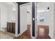 Hallway with dark accent wall and hardwood floor at 8757 Via Tavoleria Way, Windermere, FL 34786