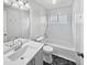 Updated bathroom with white vanity and tub/shower combo at 8813 Parliament Ct, Kissimmee, FL 34747