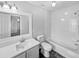 Clean bathroom, bathtub, toilet and vanity with updated fixtures at 8813 Parliament Ct, Kissimmee, FL 34747