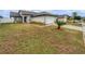 Landscaped front yard with a paved walkway to the front door at 8813 Parliament Ct, Kissimmee, FL 34747