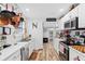 Well-equipped kitchen featuring white cabinets and a marble countertop at 922 Wyoming Ave, St Cloud, FL 34769