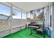 Cozy screened porch with artificial turf flooring at 922 Wyoming Ave, St Cloud, FL 34769