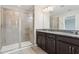 Bathroom features a walk-in shower and double vanity at 9457 Randal Park Blvd, Orlando, FL 32832