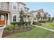 Row of townhomes showcasing architectural details and landscaping at 9457 Randal Park Blvd, Orlando, FL 32832