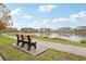 Scenic walking path alongside a peaceful lake at 9457 Randal Park Blvd, Orlando, FL 32832