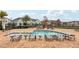 Community pool with plenty of lounge chairs at 9457 Randal Park Blvd, Orlando, FL 32832