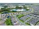 Aerial view of houses and lake in a residential community at 9693 Lost Creek Dr, Winter Garden, FL 34787