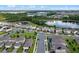 Aerial view of houses and lake in a residential community at 9693 Lost Creek Dr, Winter Garden, FL 34787