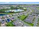 Aerial view of houses and lake in a residential community at 9693 Lost Creek Dr, Winter Garden, FL 34787