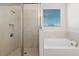 Bathroom with shower, bathtub, and double vanity at 9693 Lost Creek Dr, Winter Garden, FL 34787