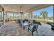 Relaxing covered patio with comfortable seating overlooking the lake at 9693 Lost Creek Dr, Winter Garden, FL 34787