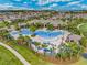 Large, resort-style pool with surrounding lounge chairs at 9693 Lost Creek Dr, Winter Garden, FL 34787