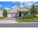 Two-car garage and charming front yard at 9693 Lost Creek Dr, Winter Garden, FL 34787