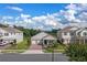 Exterior view of a two-story house with a brick driveway at 9693 Lost Creek Dr, Winter Garden, FL 34787