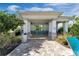 Covered picnic area with tables and seating near the pool at 9693 Lost Creek Dr, Winter Garden, FL 34787