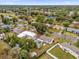 Aerial view of a house and neighborhood, showcasing the property's location and surroundings at 107 Japonica Dr, Orlando, FL 32807