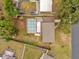 Aerial view of house with pool and neighborhood at 107 Japonica Dr, Orlando, FL 32807