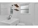 Clean bathroom with white vanity, shelves, and a window at 107 Japonica Dr, Orlando, FL 32807