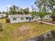Newly renovated light gray house with yard at 107 Japonica Dr, Orlando, FL 32807
