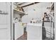 White laundry room with washer, dryer, and utility sink at 107 Japonica Dr, Orlando, FL 32807