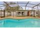 Inviting screened pool with concrete patio at 107 Japonica Dr, Orlando, FL 32807