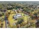 Aerial view of house, pool, large yard, and surrounding area at 1096 N Thorpe Ave, Orange City, FL 32763