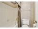 Bathroom featuring a tub and shower combination with a toilet at 1106 Woodbine St, Fern Park, FL 32730