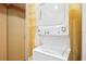 Laundry room with a stacked washer and dryer unit to save space at 1106 Woodbine St, Fern Park, FL 32730