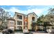 Two-story building with multiple units and ample parking at 12602 Crest Springs Ln # 1314, Orlando, FL 32828